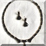 J05. Sterling silver and onyx necklace and earrings. 